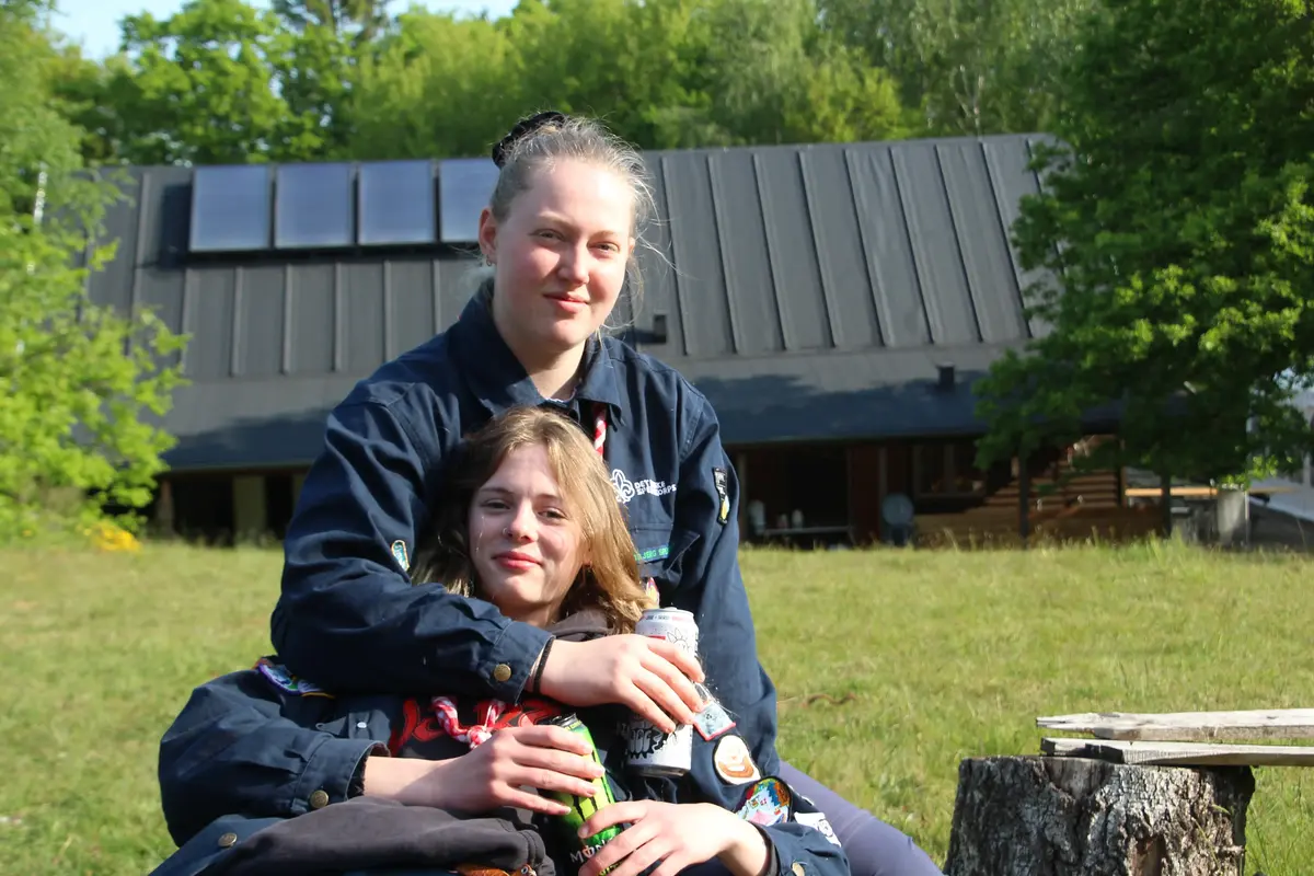A couple of girls resting with sodas