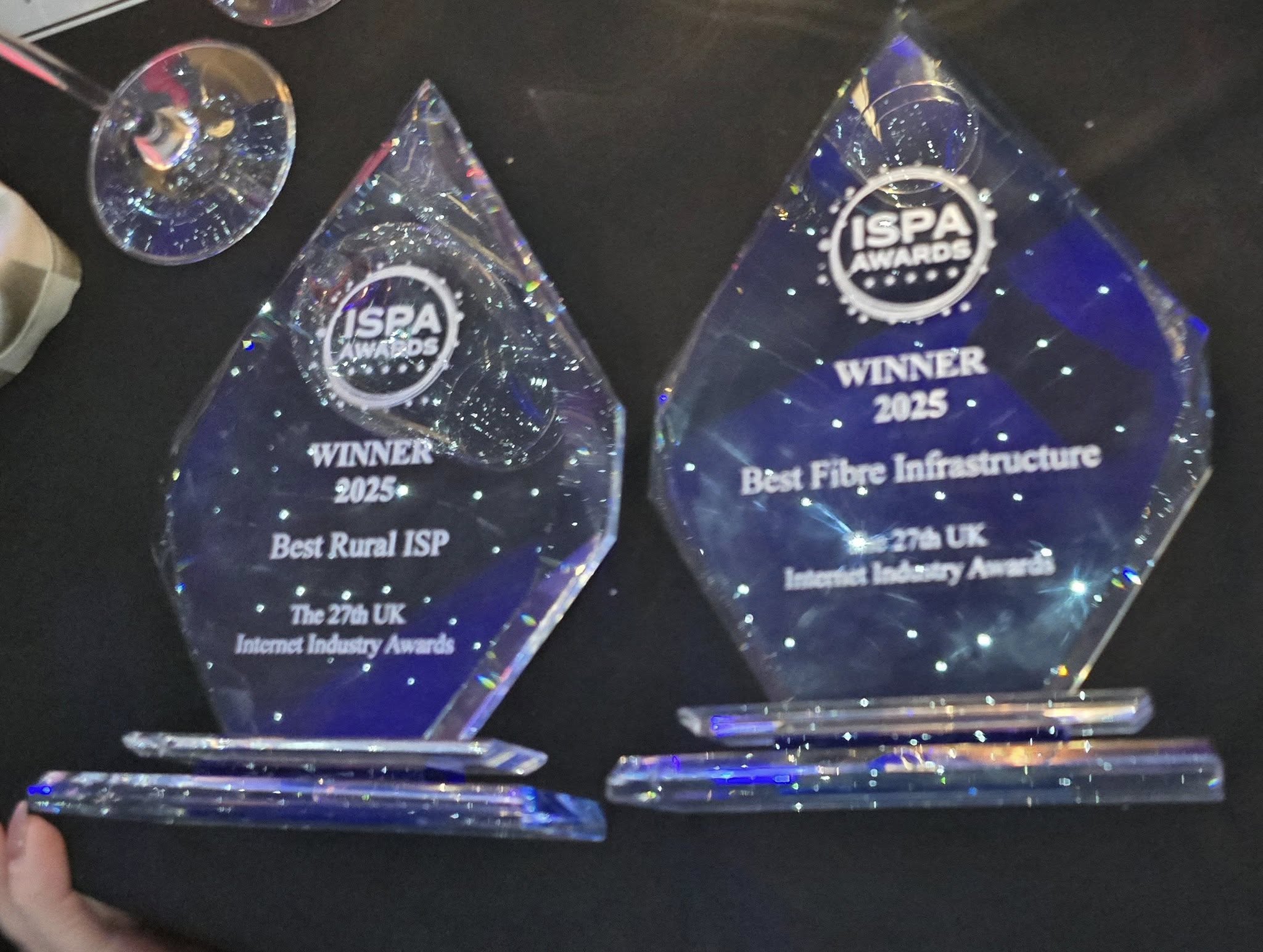 Two clear crystal ISPA Awards for Winner 2025: Best Rural ISP and Best Fibre Infrastructure at the 27th UK Internet Industry Awards.