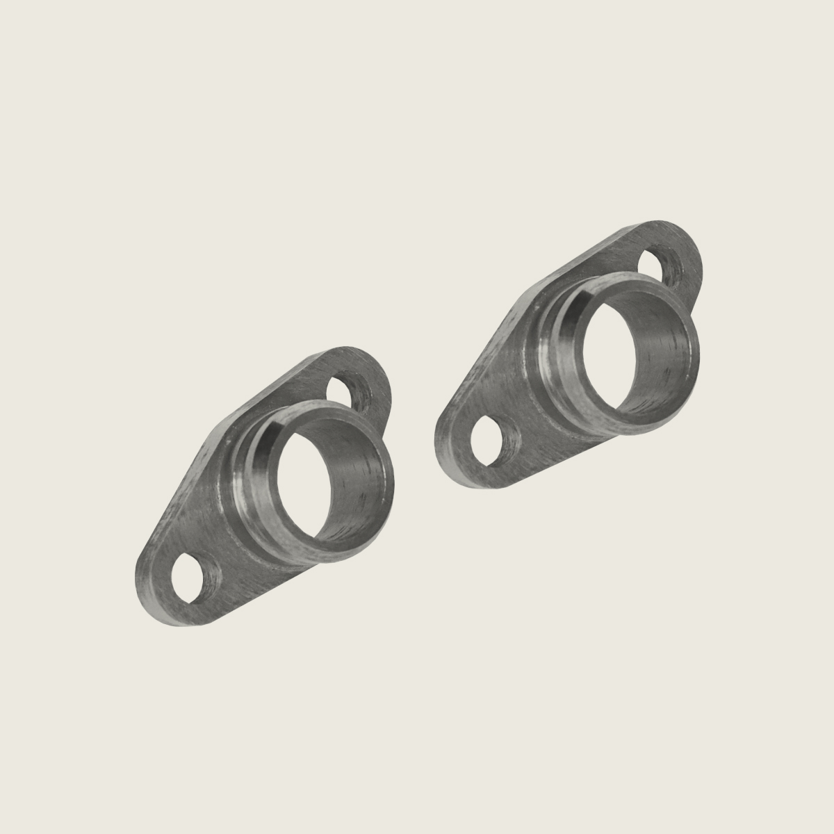 Two small metal flanges with circular openings and two bolt holes, shown on a light background.