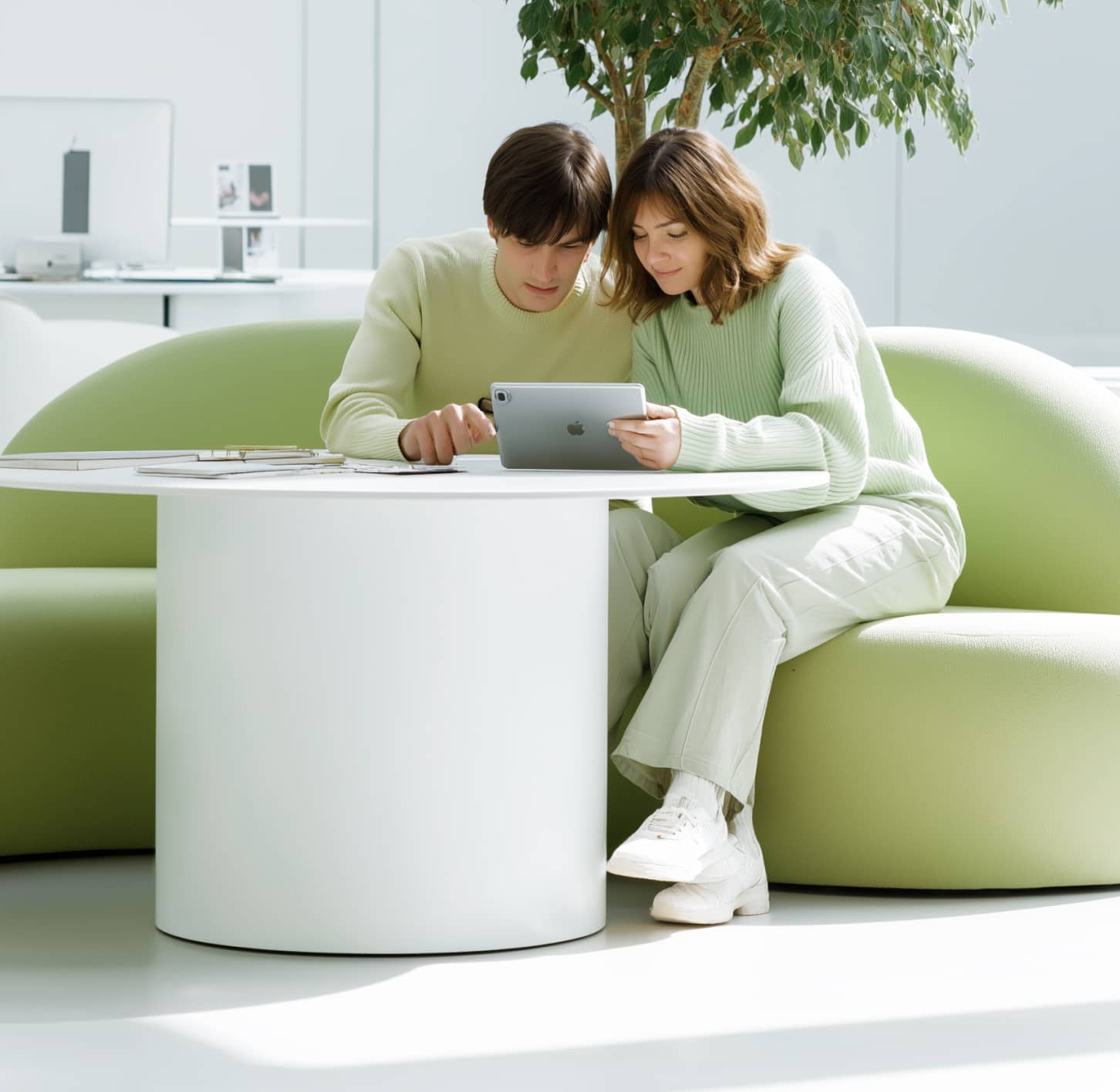 Couple Using Tablet In Modern Minimal Workspace Techpay Webflow Template | BRIX Template