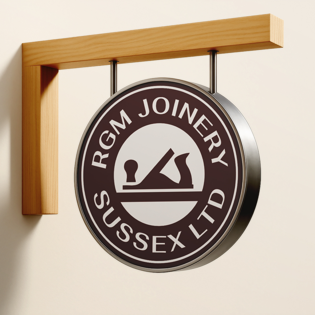 RGM Joinery logo on a handmade hanging sign. 