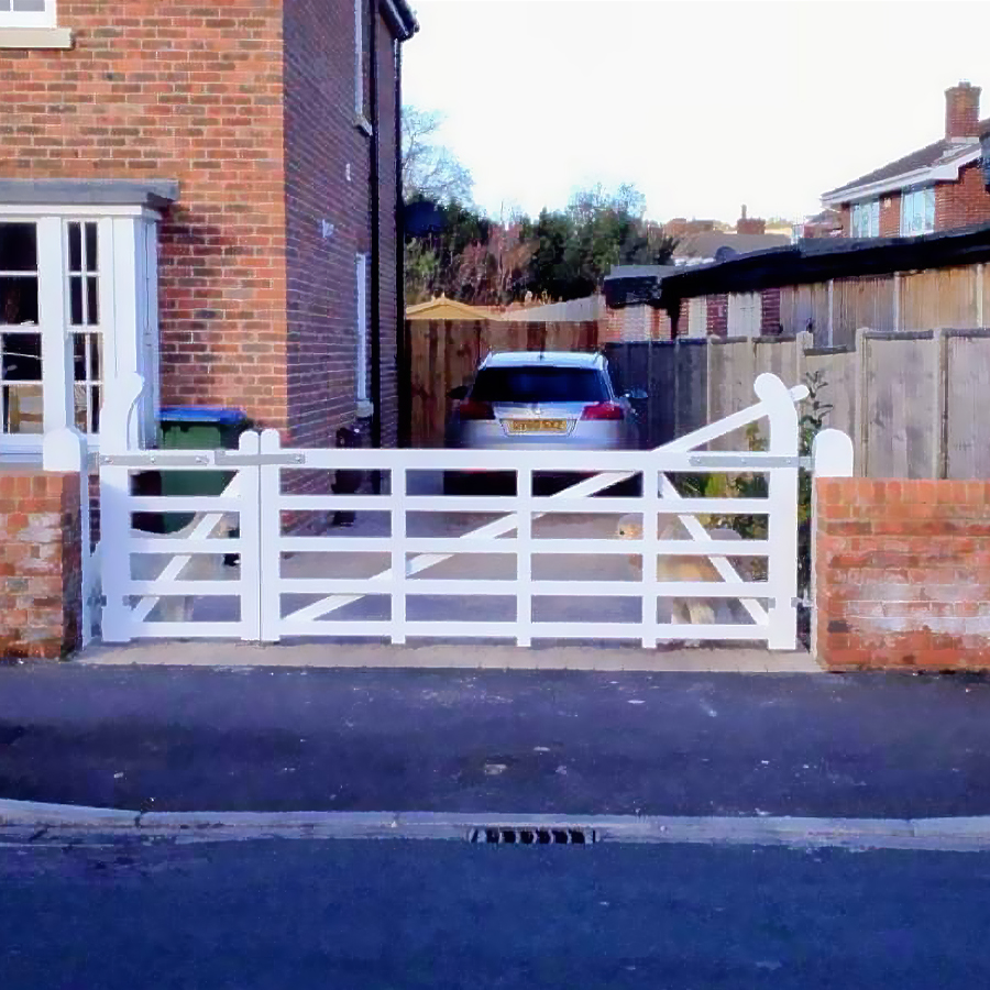 An expert made wooden driveway gate designed and worked by RGM Joinery's expert team