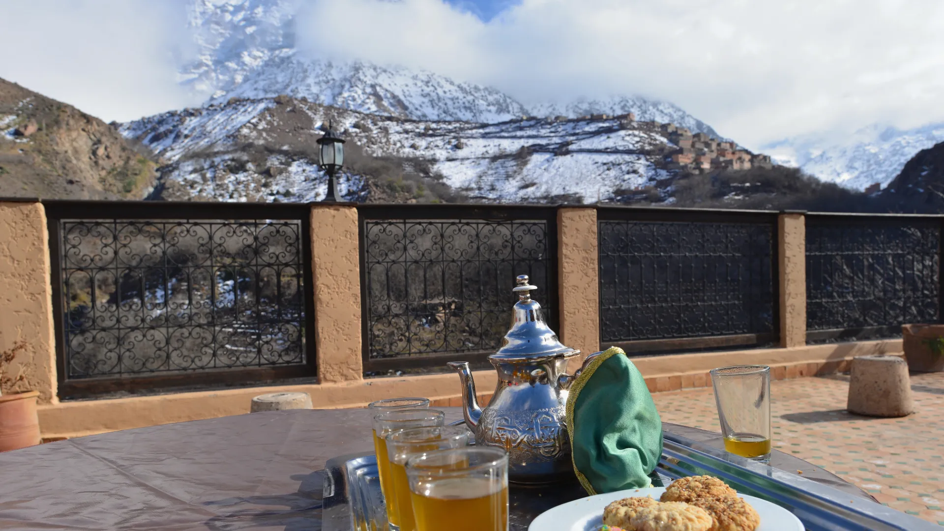 Traditional Moroccan breakfast overlooking the High Atlas Mountains near Imlil