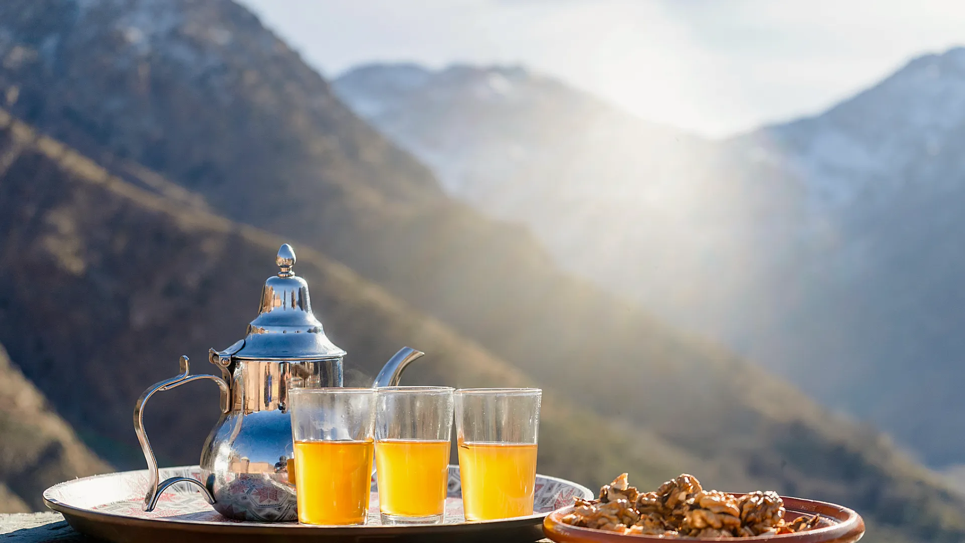 Moroccan mint tea served on a terrace overlooking the High Atlas Mountains