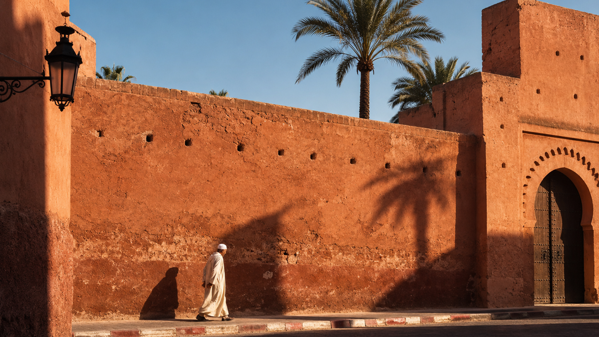A traveller walking beneath an arch in the Fes medina.
