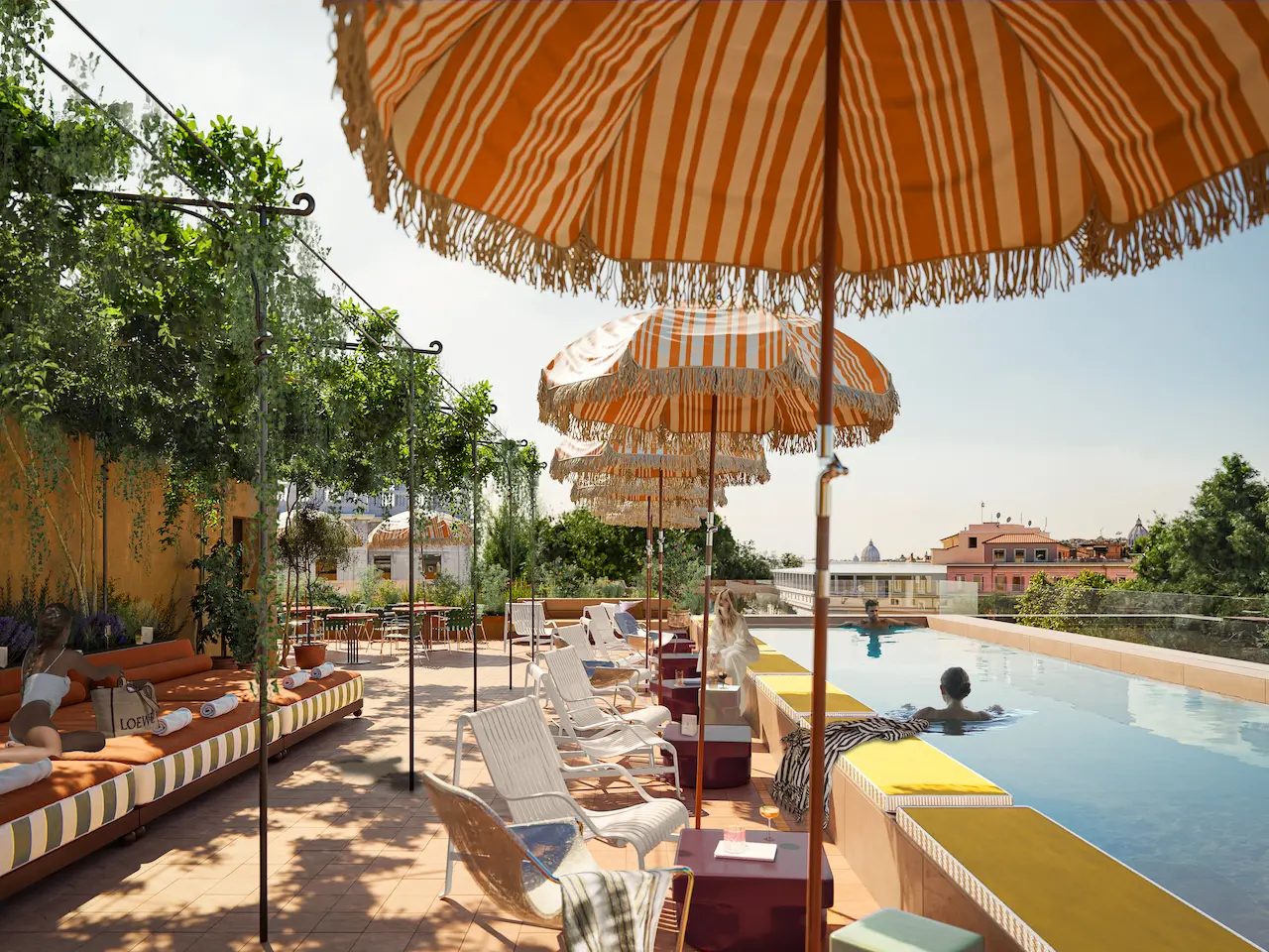 Rooftop terrace at Experimental Roma with striped parasols, pool and sun loungers.