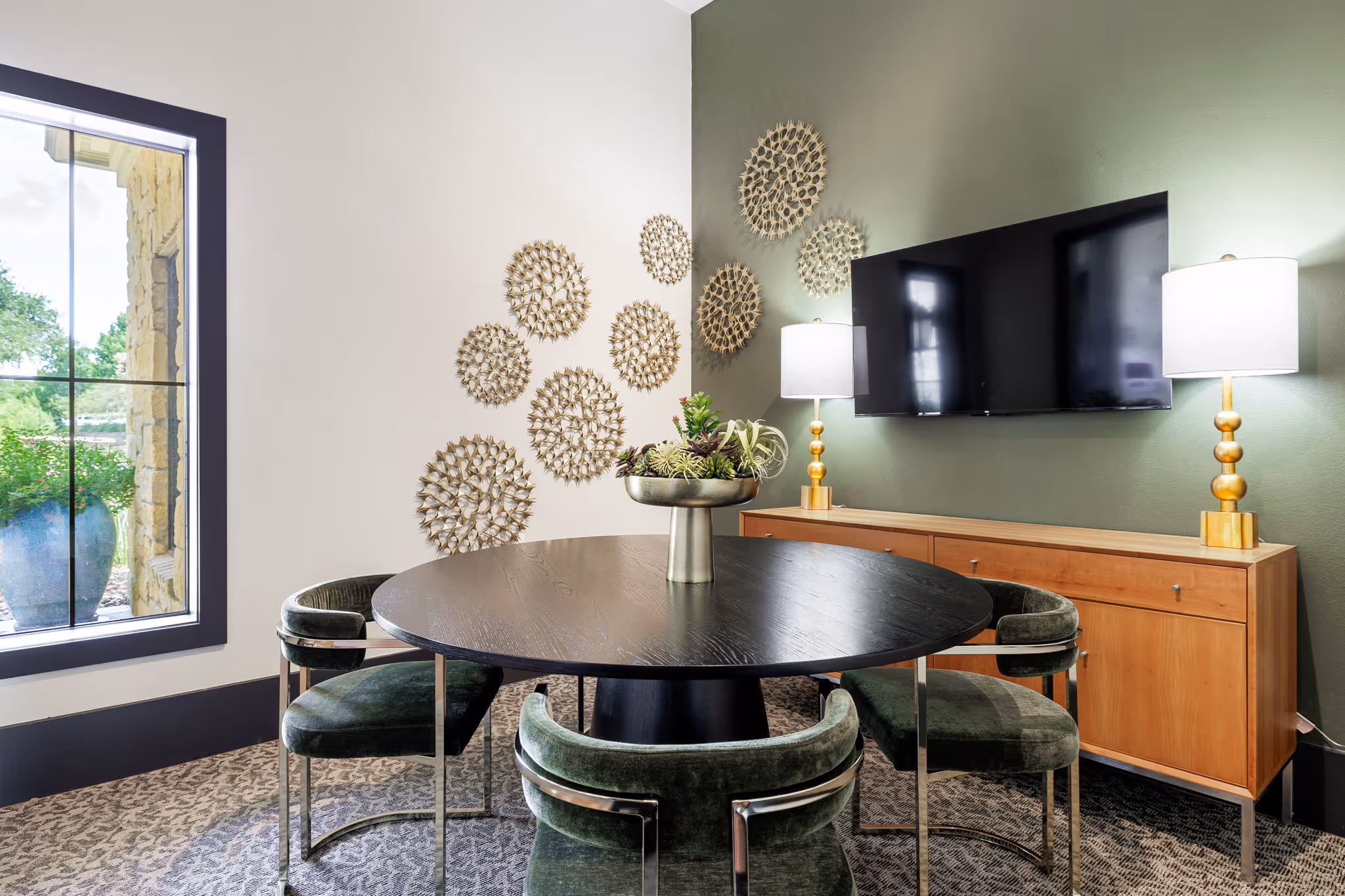 media room with tv and char with tables