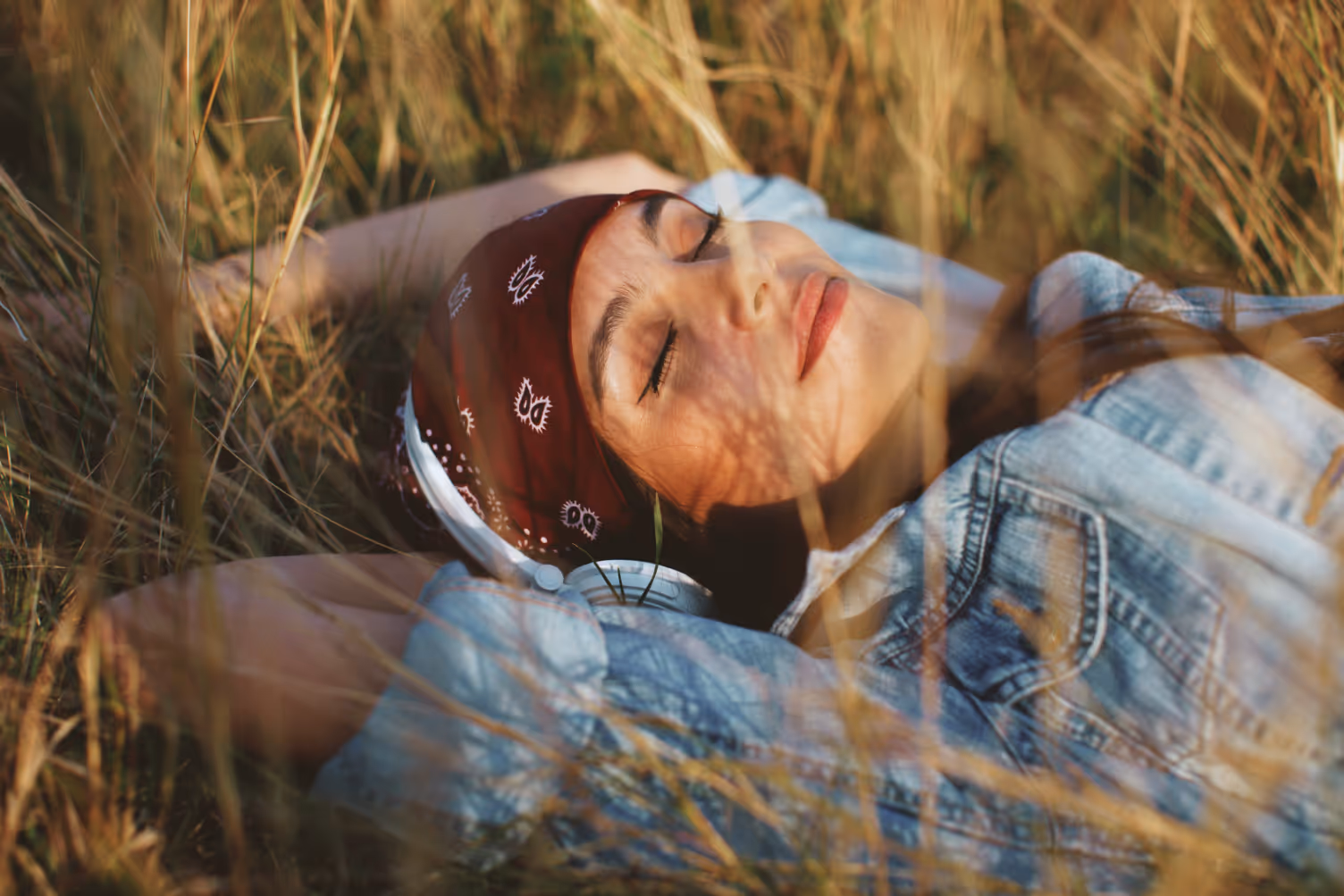 woman relaxing in grass stock image
