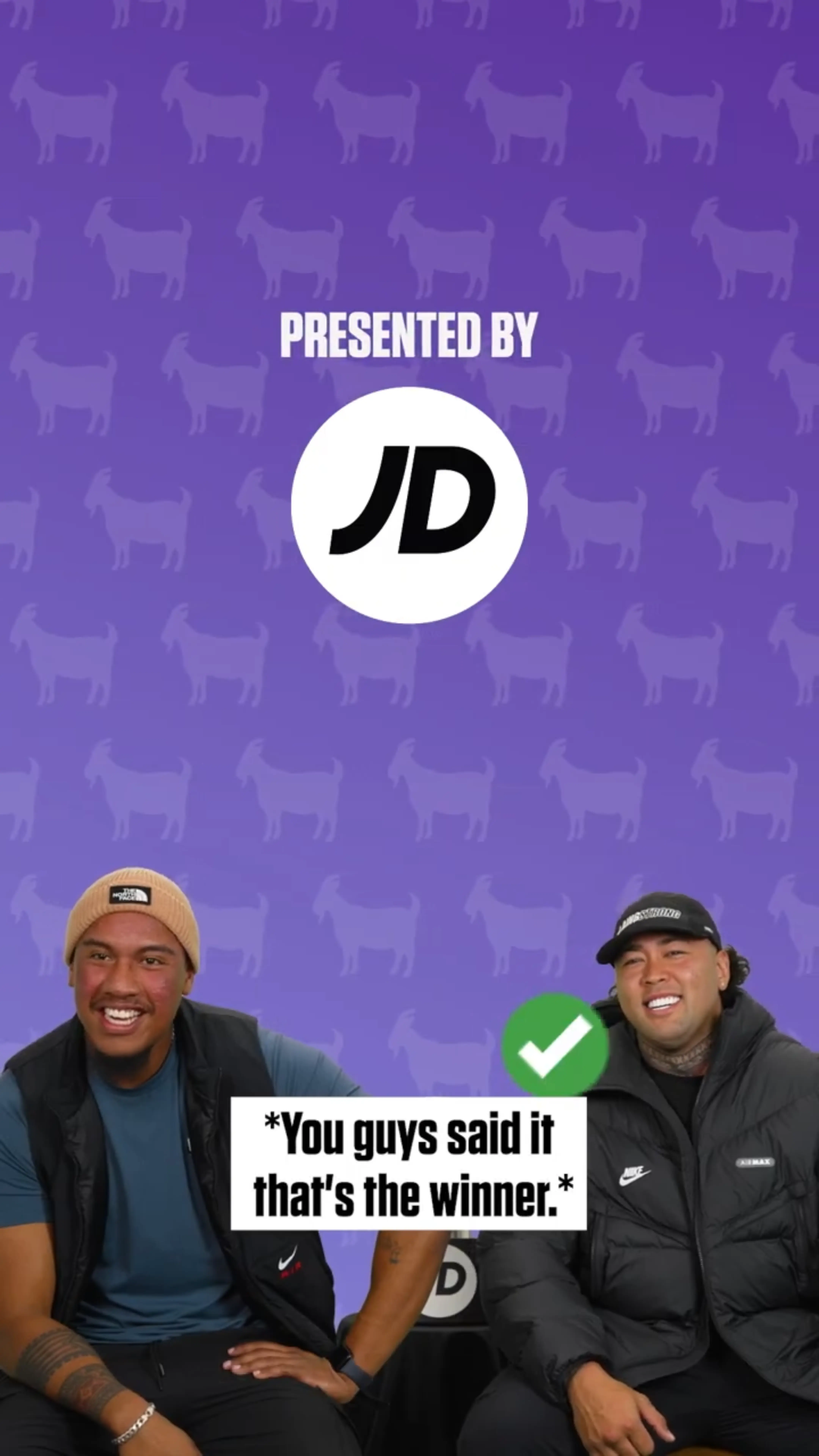 Two smiling men sitting in front of a purple background with goat silhouettes, with JD logo and text 'Presented by JD' above them and a caption saying 'You guys said it that's the winner.'