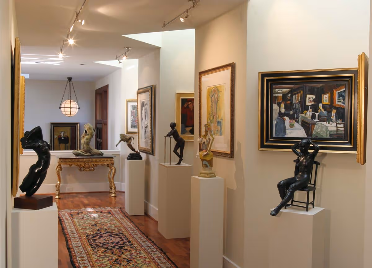 Bright living room with large windows, a black grand piano, gray armchair, sofa with cushions, and flower vases on tables.