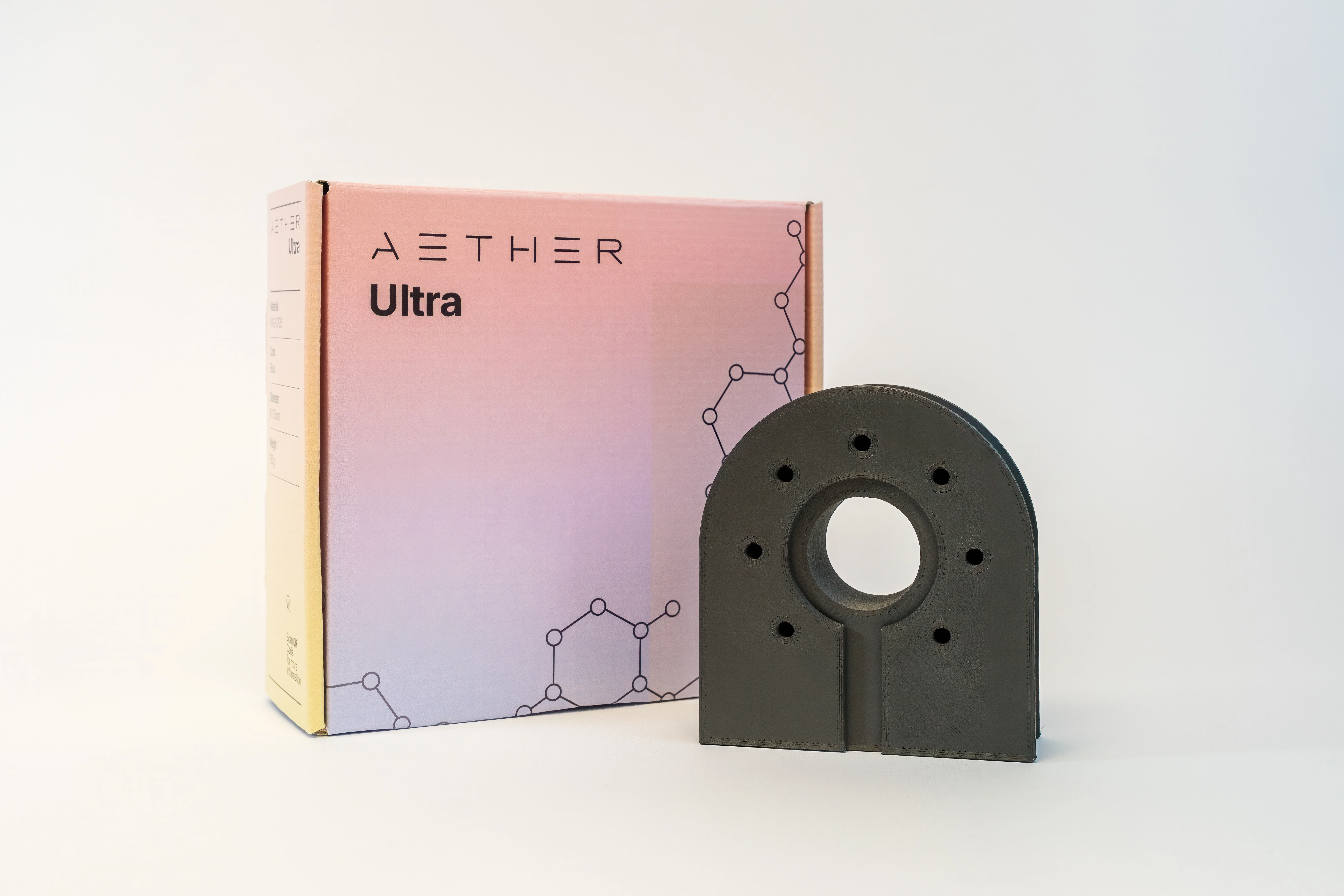 Close-up of a perforated metallic surface with orange and blue light reflections.