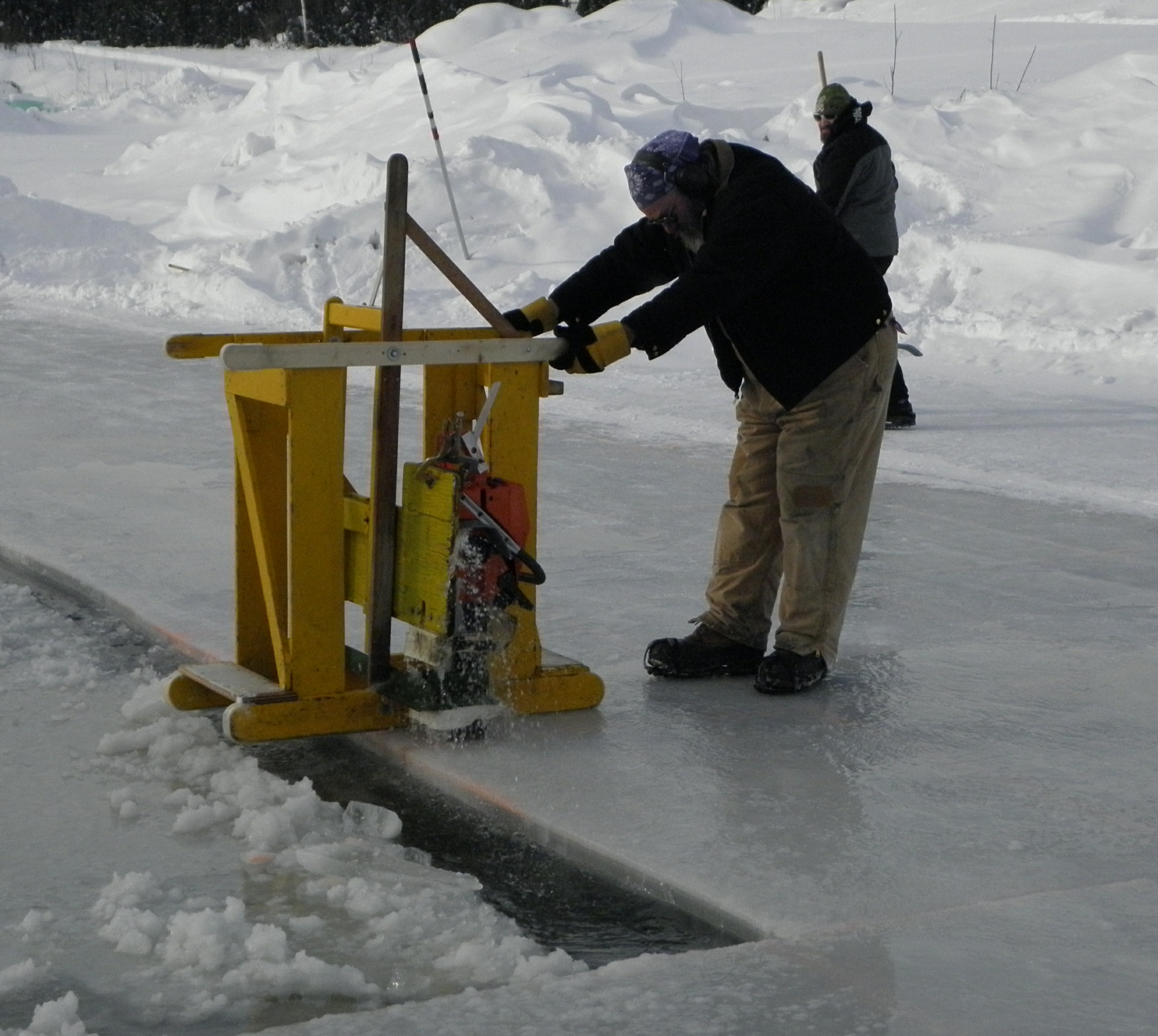 Jasper harvesting on pond Ice Alaska