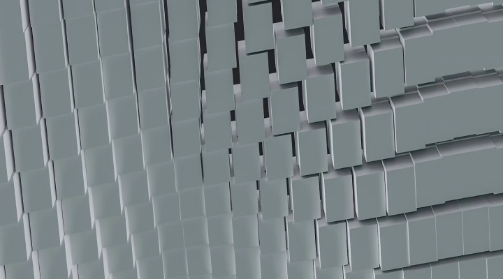 Close-up of a three-dimensional abstract surface with overlapping and staggered rectangular tiles in varying shades of gray.