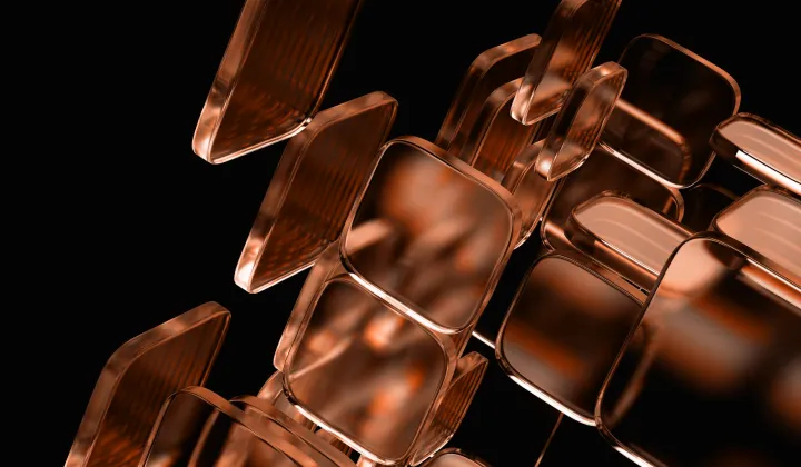 Cluster of semi-transparent, copper-colored square shapes floating against a black background.