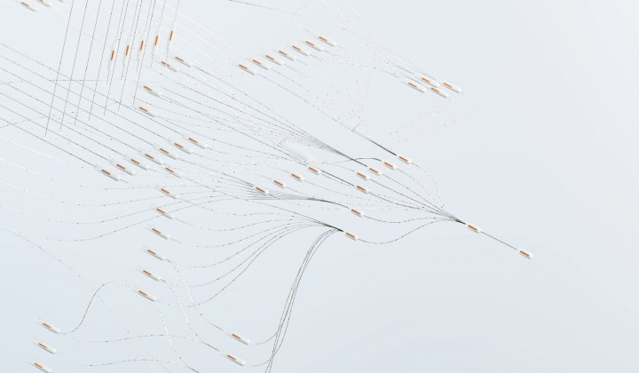 Aerial view of multiple small boats with long nets arranged in curved lines on calm pale blue water.