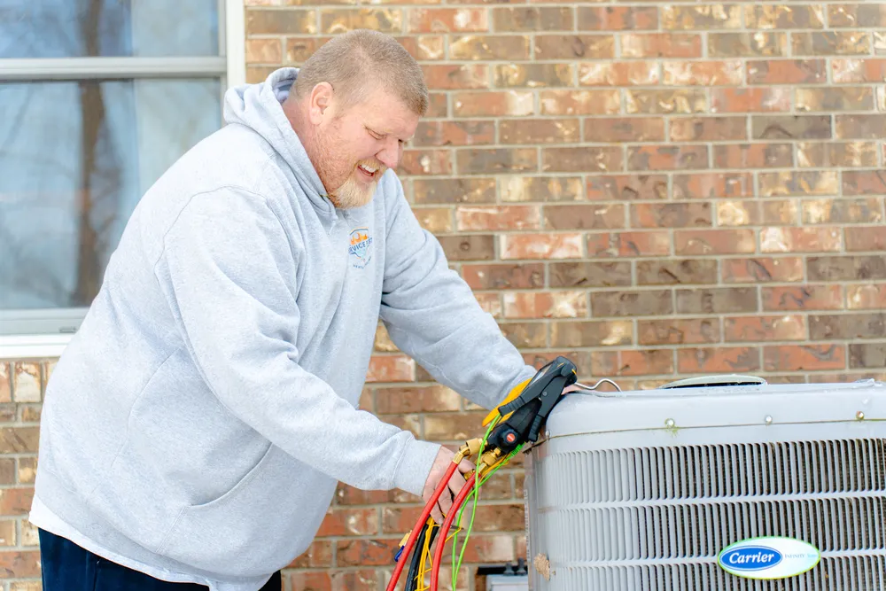 a hvac technician providing a diagnostic on a heat pump