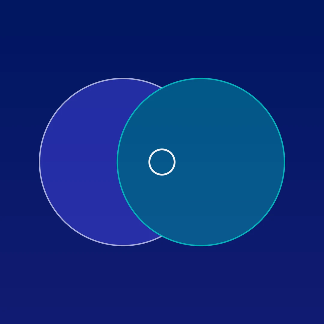 Two overlapping circles in blue and teal on a navy background, representing a HubSpot and Salesforce comparison