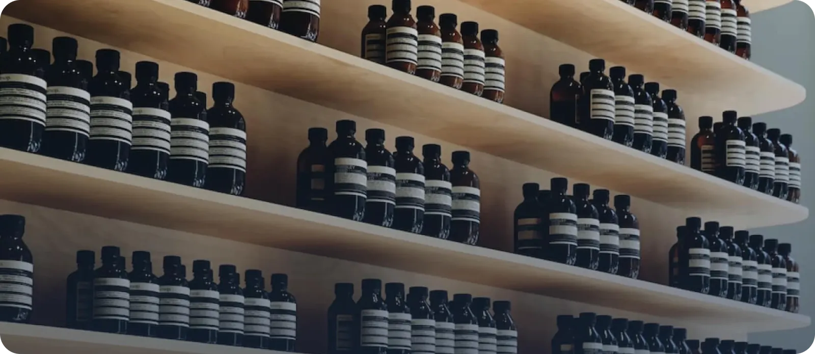 Rows of salon hair and beauty products on wooden shelves