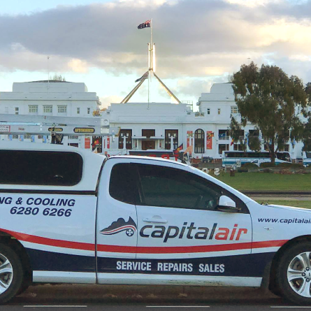 Capital Air Group branded service vehicle parked near Canberra landmarks.