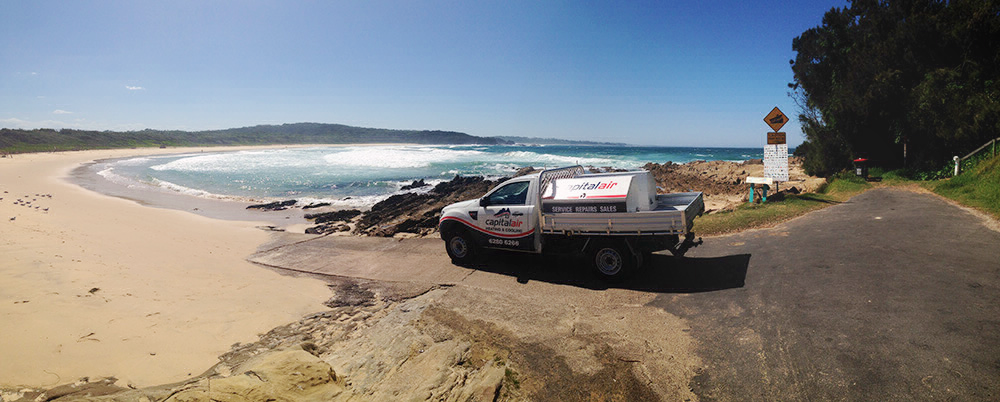 Capital Air service vehicle parked near the coastline while servicing customers in the Canberra region.