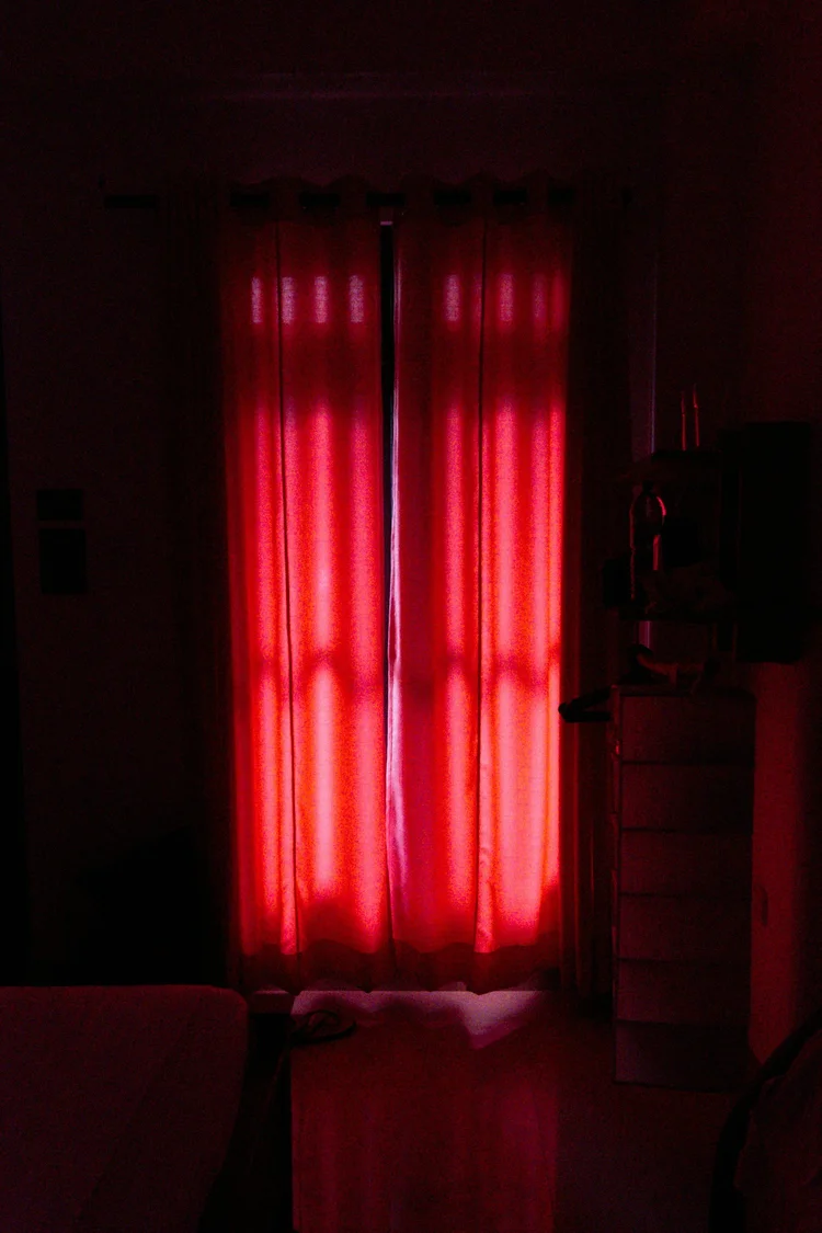 Collage with a smiling man showing his bare back, a close-up of a bald forehead, and a pair of smooth crossed legs against a purple background.