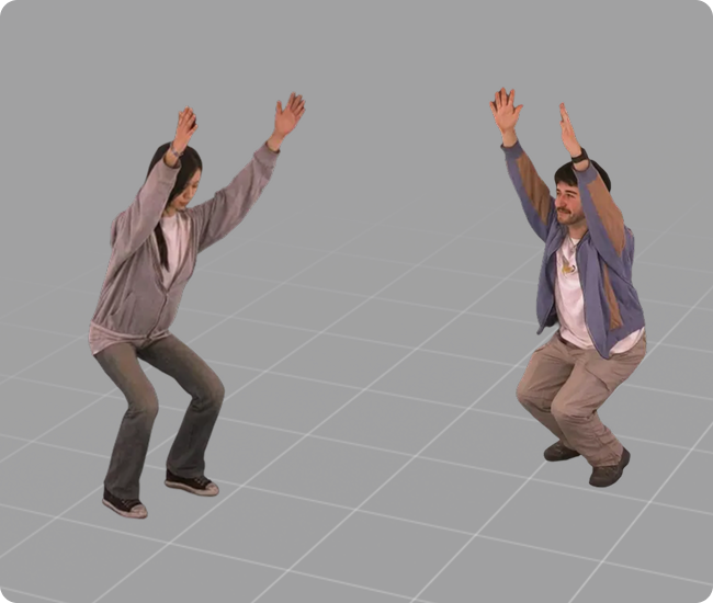 A man and woman in casual clothes squatting with their arms raised against a dark grid background.