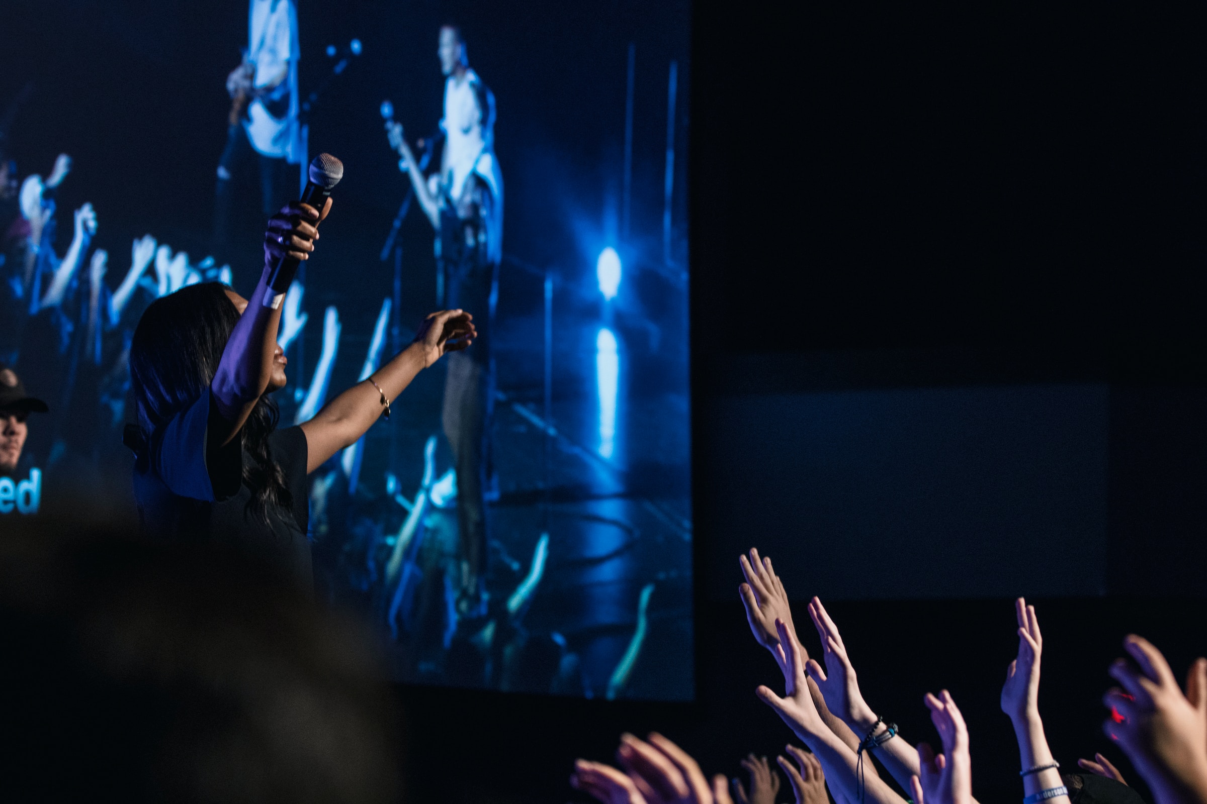 A worship leader leading the congregation in worship