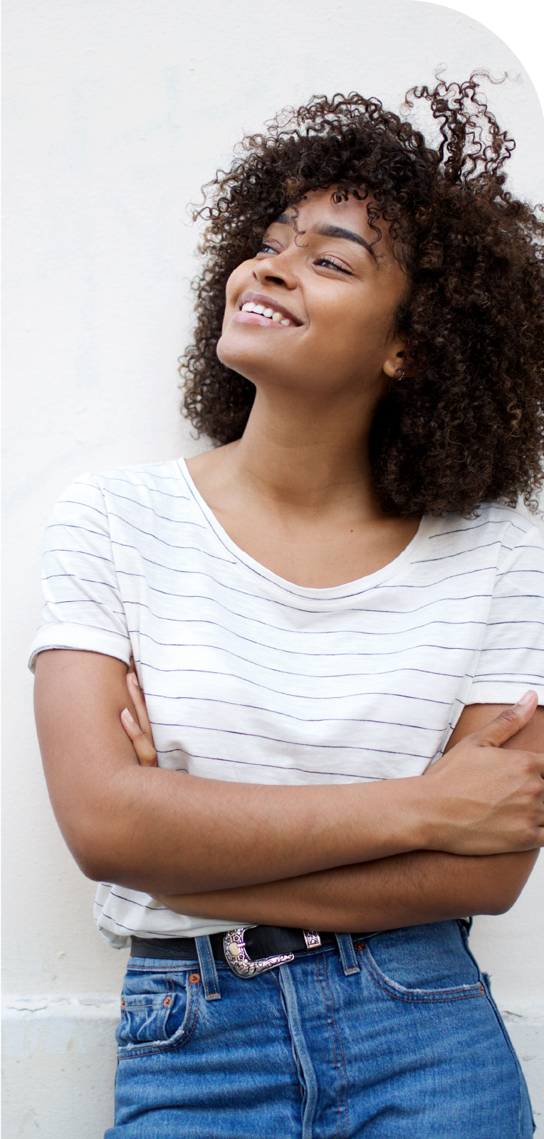 A woman looking optimistically off into the distance