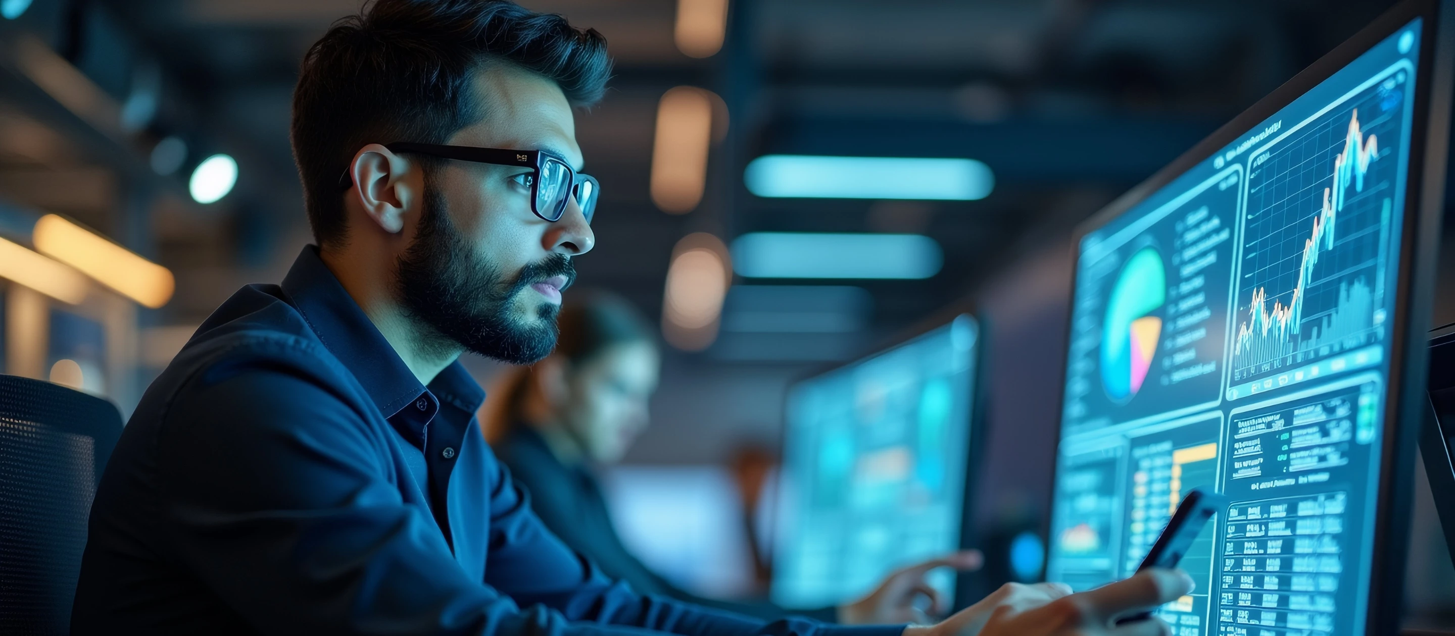 Engineer looking at monitors in NOC