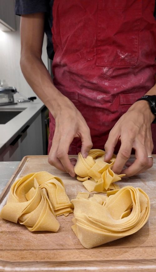 image of passengers boarding a bus at a city bus station
