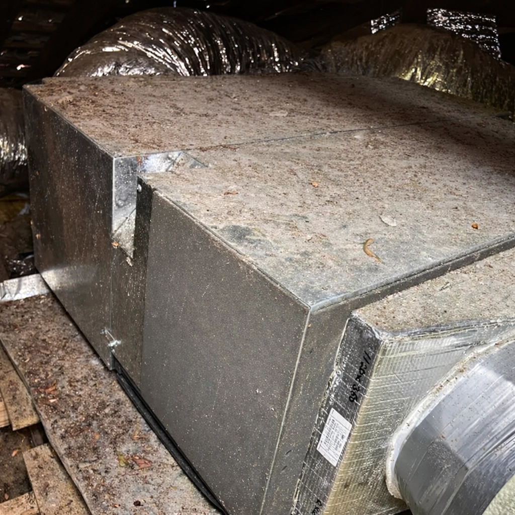 Ducted heating unit connected to insulated ductwork in roof space.