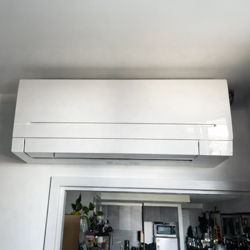 Wall-mounted split system air conditioner installed in a residential room.