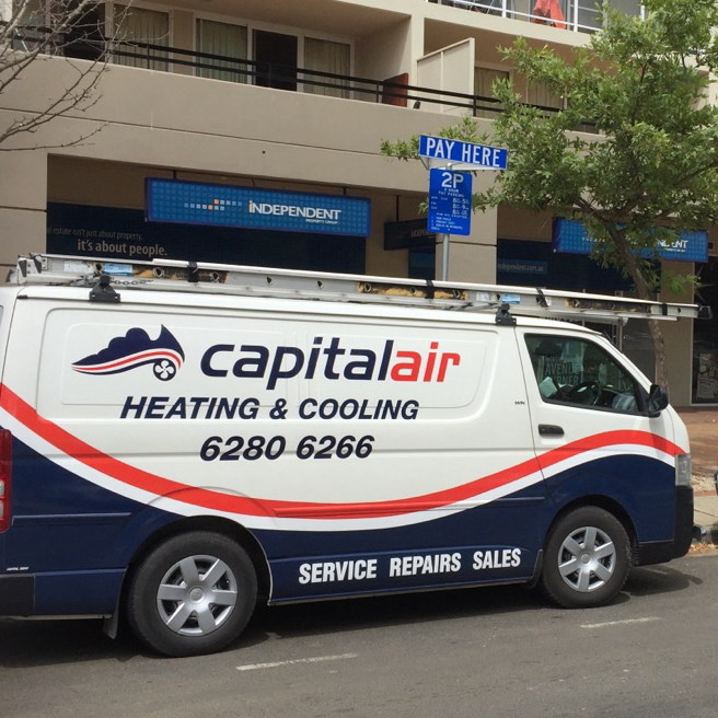 Capital Air heating and cooling service vehicles parked on a Canberra street while attending jobs.