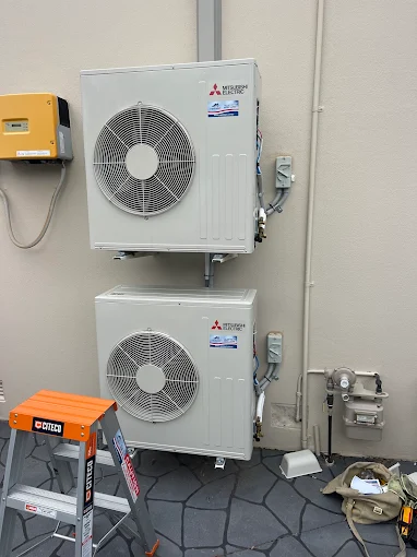 Residential air conditioning installation with Mitsubishi Electric system.