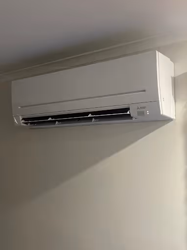 Wall-mounted split system air conditioning unit for Kingston living spaces.