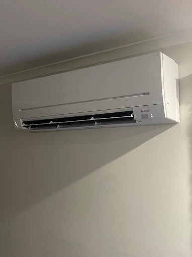 Wall-mounted split system air conditioning unit for Kingston living spaces.