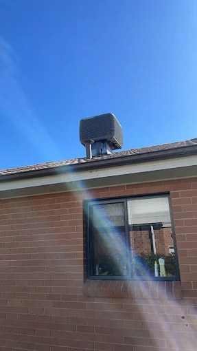 Energy-efficient air conditioning system installed on a Lyneham home rooftop in Canberra.