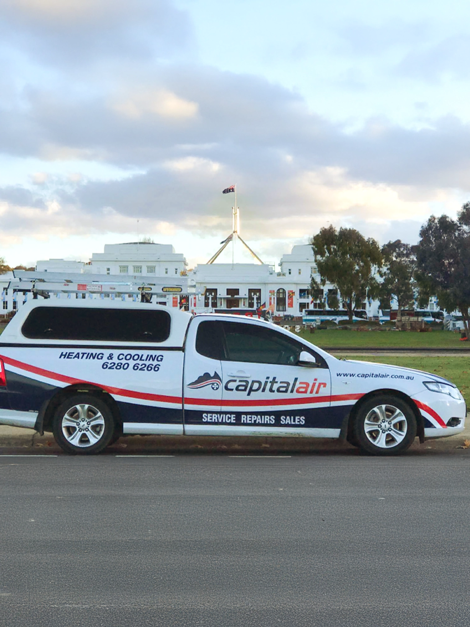 Capital Air service vehicle parked near Parliament House in Canberra.