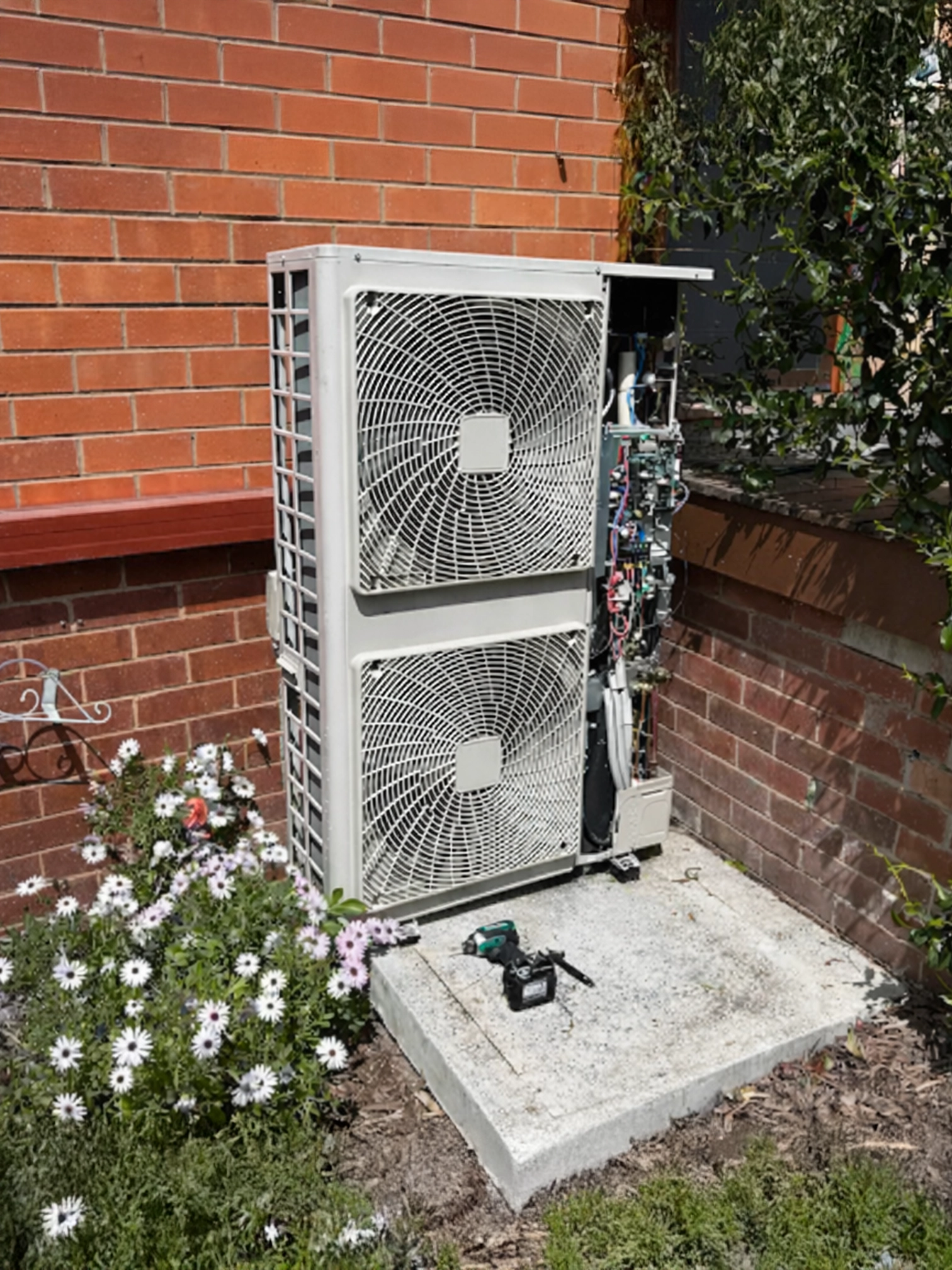 Outdoor air conditioning system installation at a residential property.