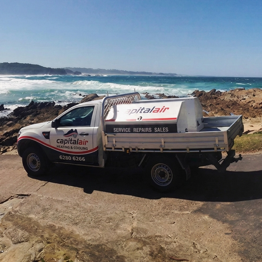 Capital Air service vehicle parked near the coast during a heating and cooling service job.