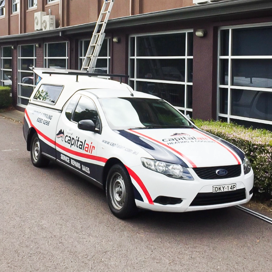 Capital Air heating and cooling vehicle at commercial job location.