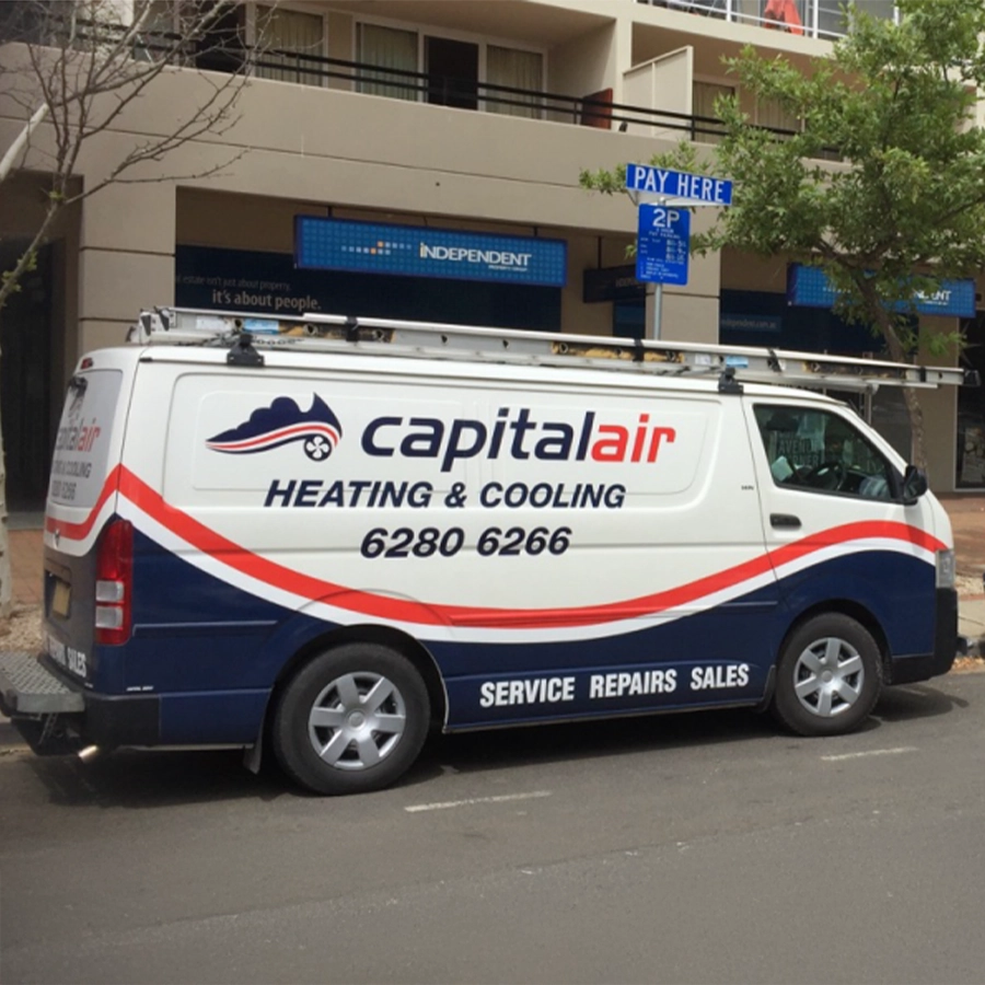 Capital Air heating and cooling service vehicles parked in Canberra.
