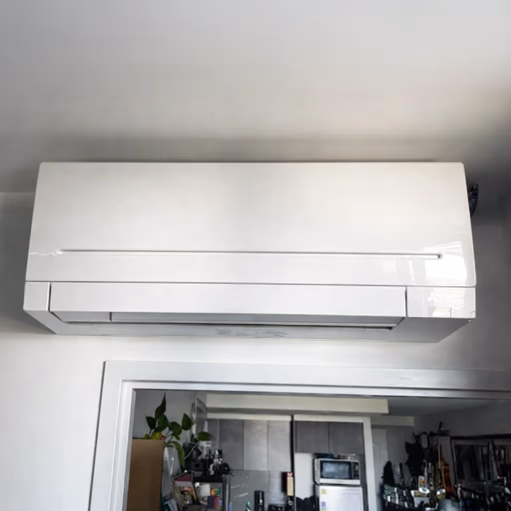 Wall-mounted split system air conditioner installed inside a home.