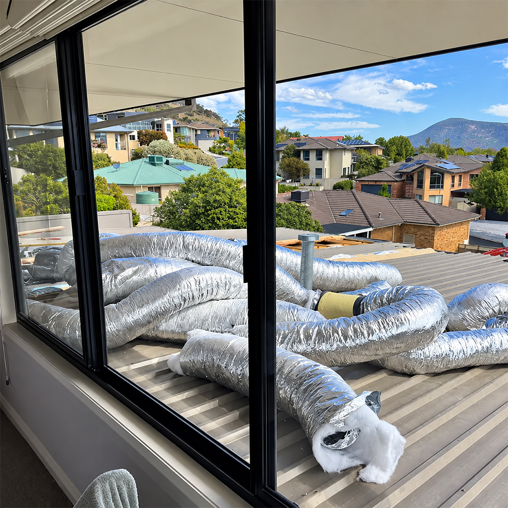 Insulated ductwork installed across the roof of a residential property.