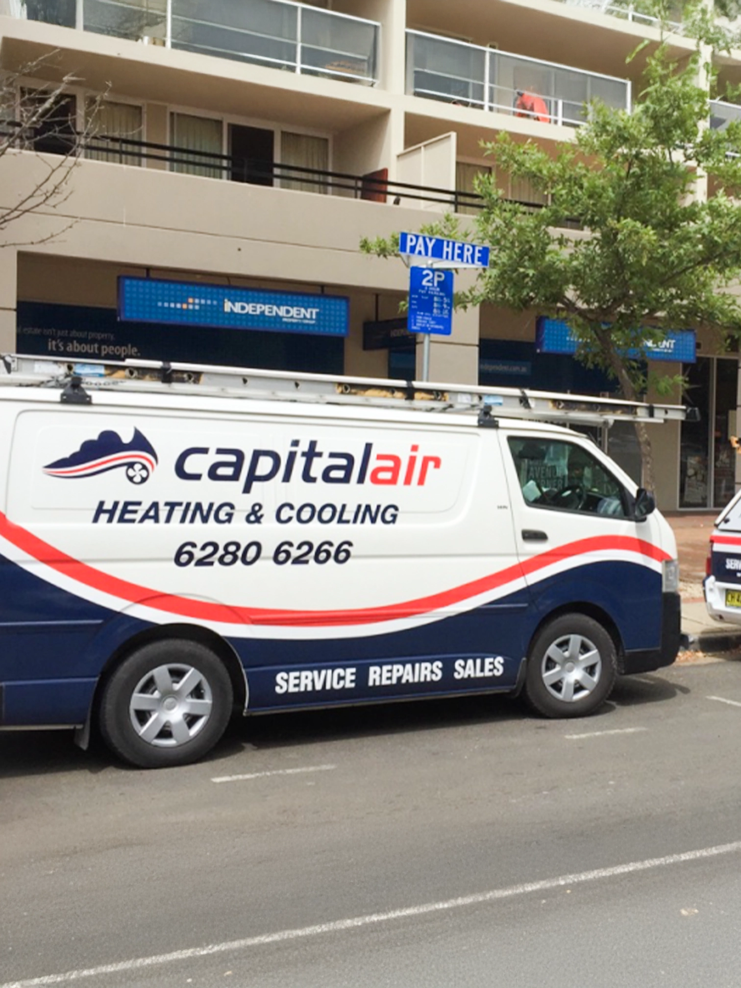 Capital Air heating and cooling service vehicles in Canberra.