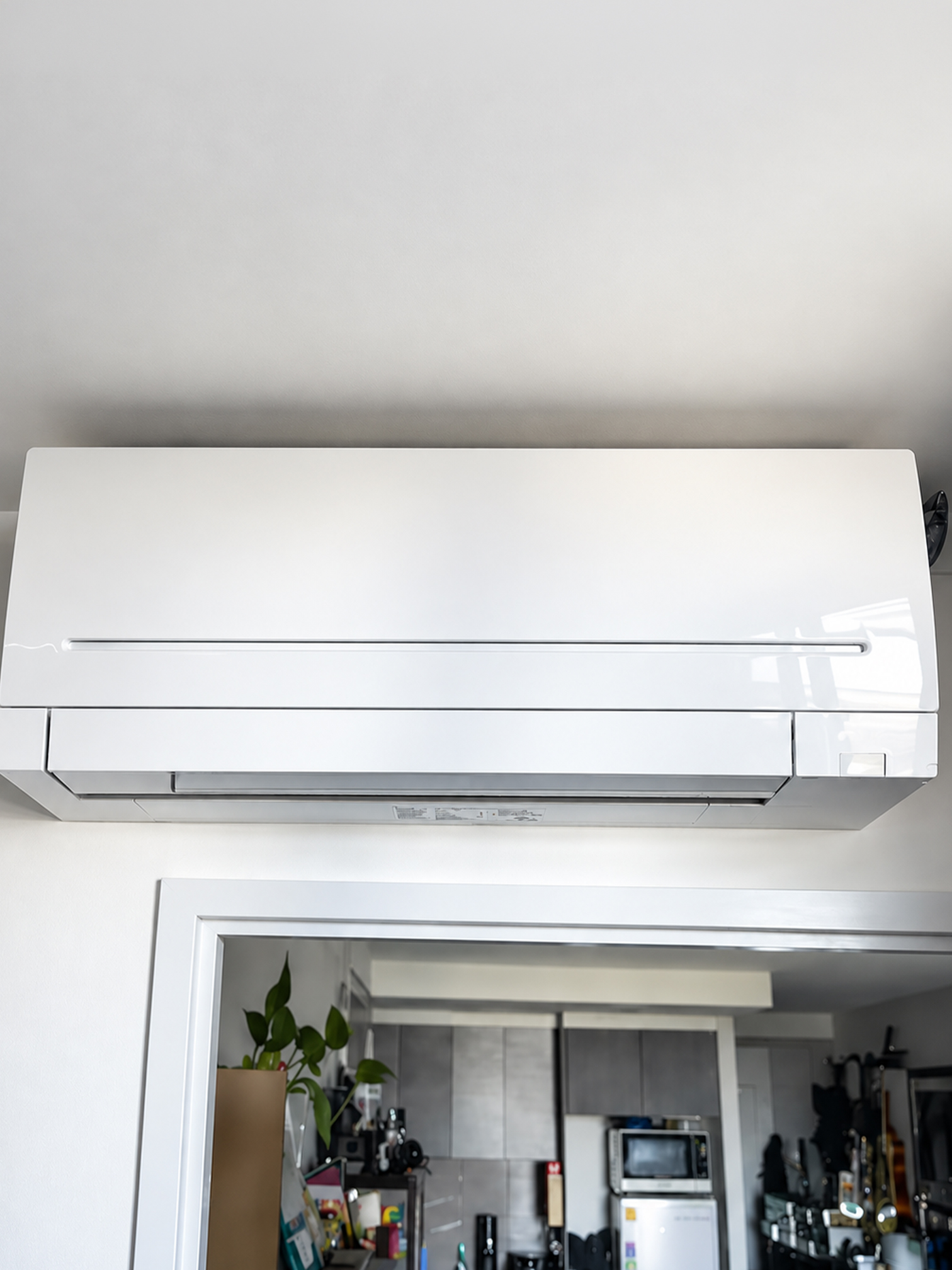 Wall-mounted split system air conditioner installed inside a home.