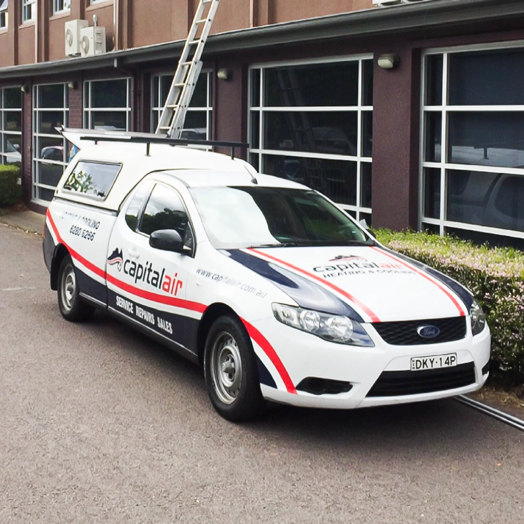 Capital Air service vehicle outside a commercial property.