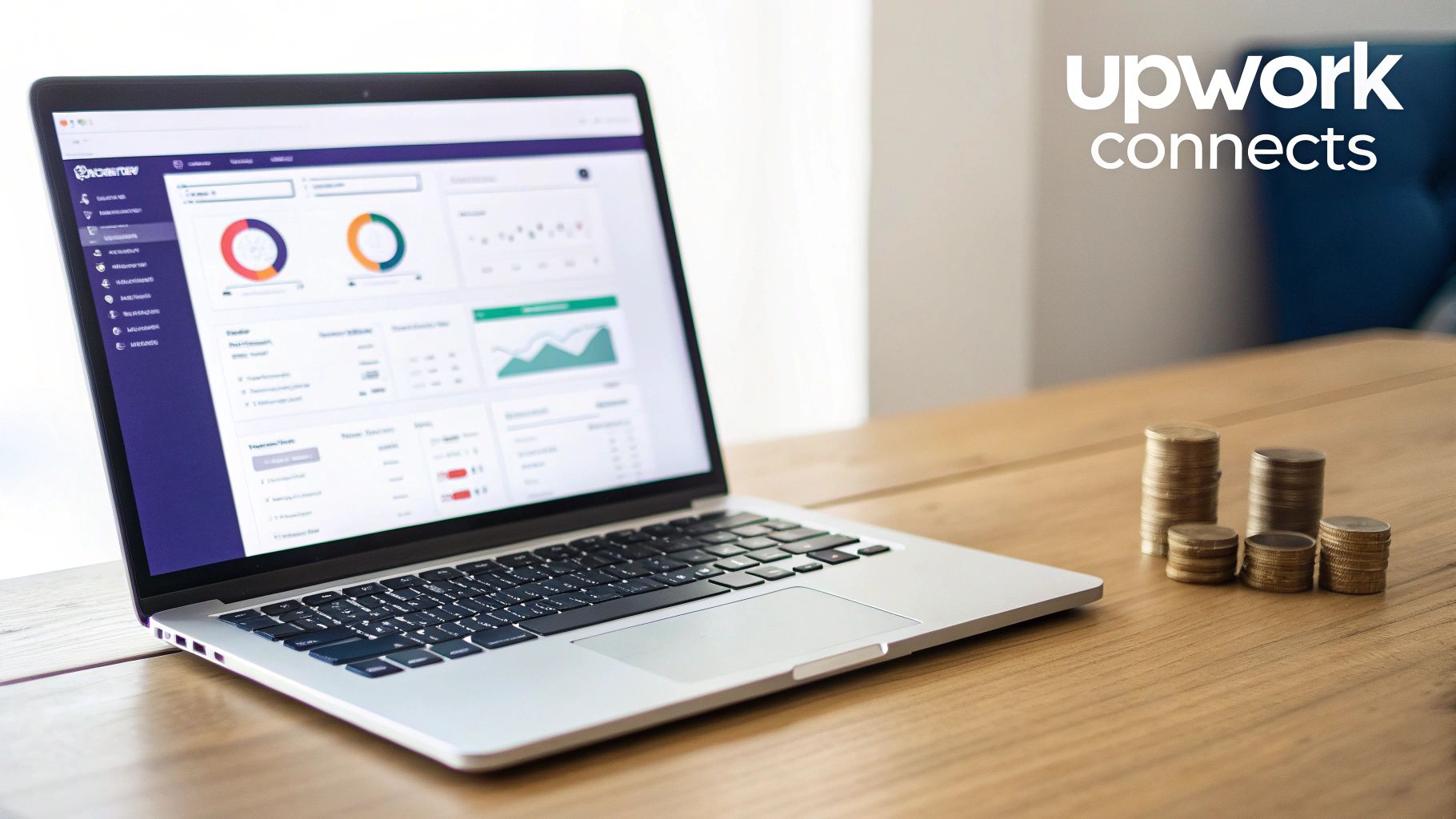 Laptop displaying data and charts, with piles of coins on a wooden table and 'Upwork connects'.