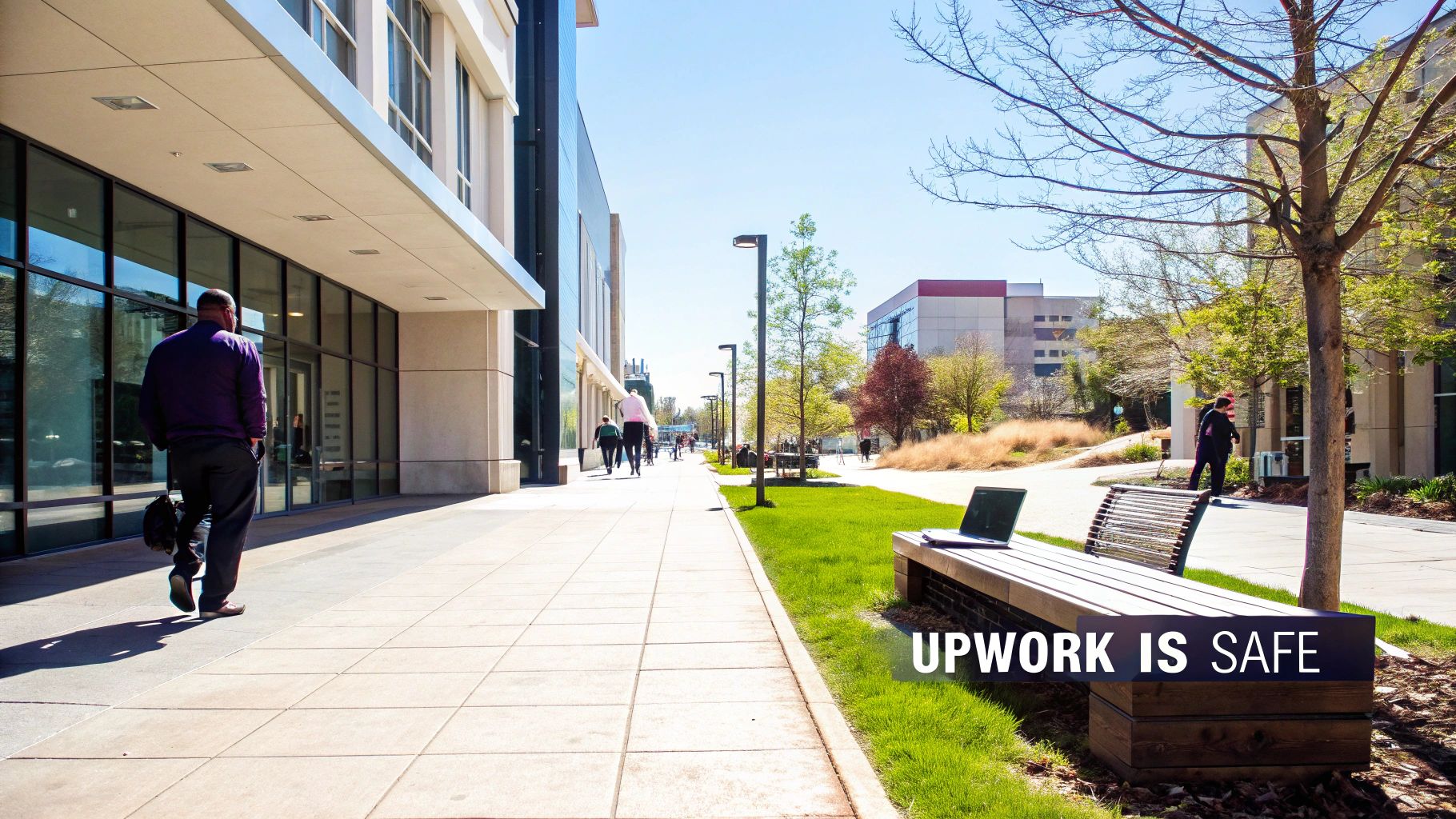 A vibrant campus scene with people walking and a laptop on a bench, featuring the text 'UPWORK IS SAFE'.