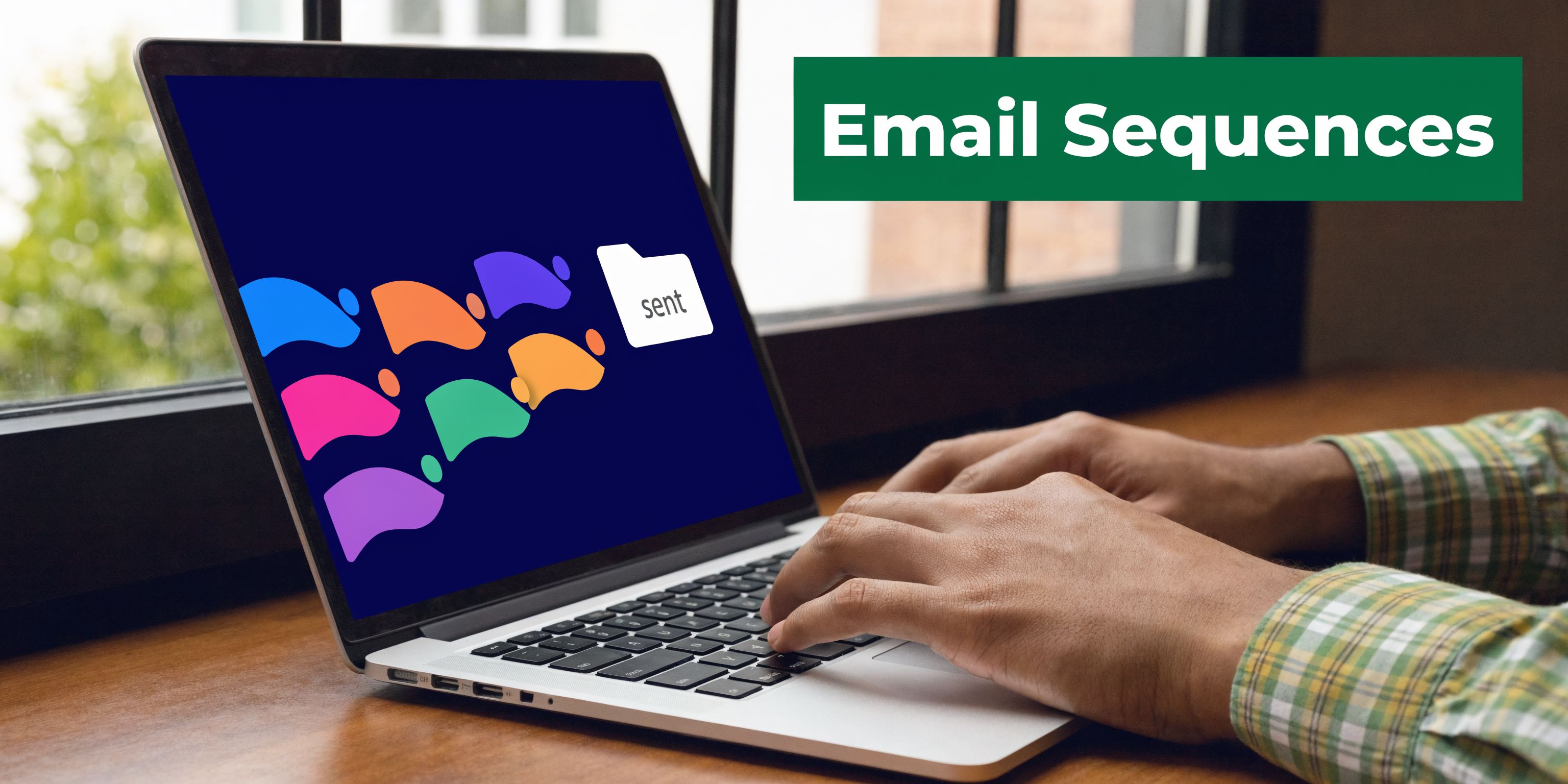 A person working on a laptop displaying a colorful email icon design related to marketing sequences.